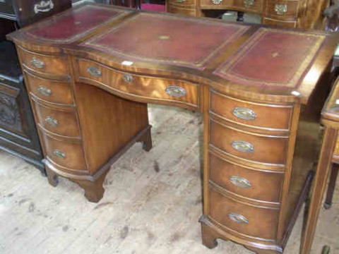 Siesta Mahogany Serpentine Front Nine-drawer Pedestal Desk with red leather...