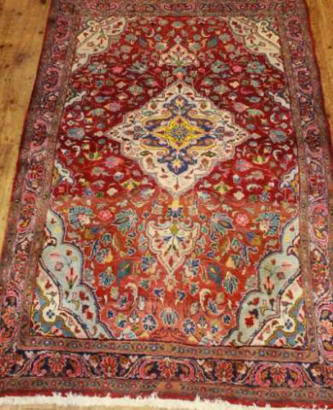 A KASHAN CARPET. 223cm by 152cm