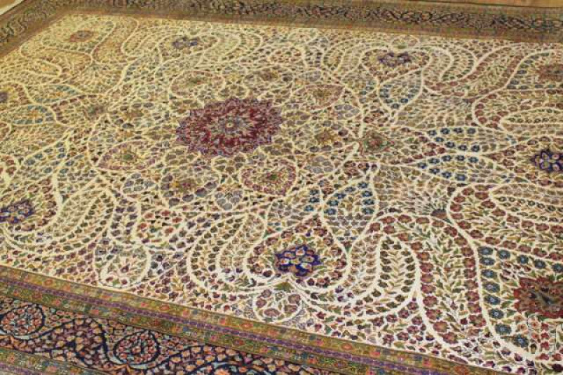A KERMAN SILK CARPET. 383cm by 268cm
