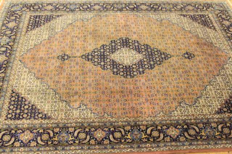 A TABRIZ CARPET. 332cm by 240cm