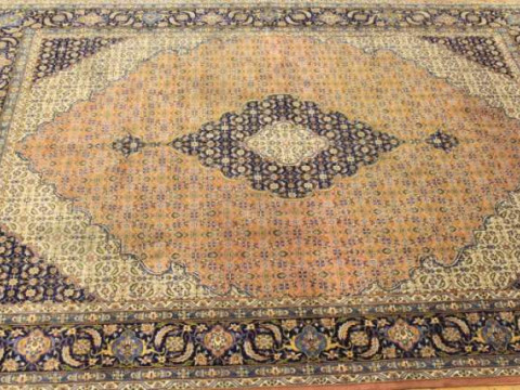 A TABRIZ CARPET. 332cm by 240cm
