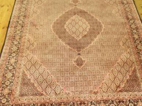 A TABRIZ CARPET, with one principal border and six smaller borders. 310cm...