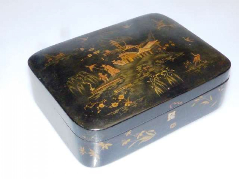 A CHINESE EXPORT CHINOISERIE LACQUER BOX, cushion-shaped with typical decoration, 30cm by 22cm; together with AN UNUSUAL JAPANESE LACQUERED TRAY, of rectangular form, decorated with insects on a grain-lacquered ground, the underside carved, signed, 37cm b