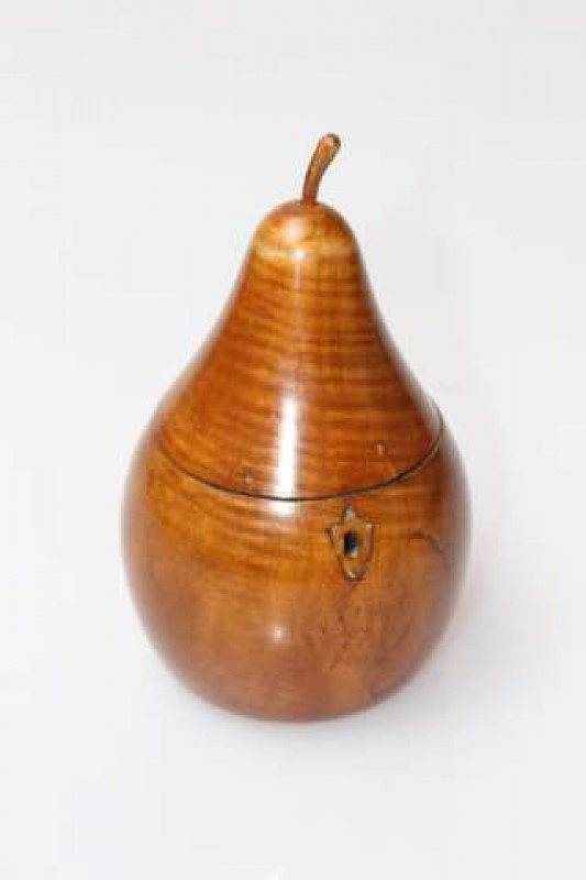 A FRUITWOOD PEAR-SHAPED TEA CADDY, with naturalistic 'stork'. 17cm