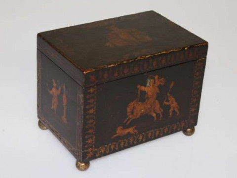 AN 18TH CENTURY BLACK JAPANNED CHINOISERIE TEA CADDY, of rectangular form,...