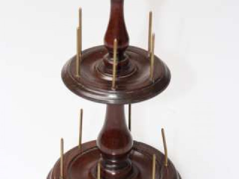 A 19TH CENTURY MAHOGANY BOBBIN STAND, with two moulded circular tiers...