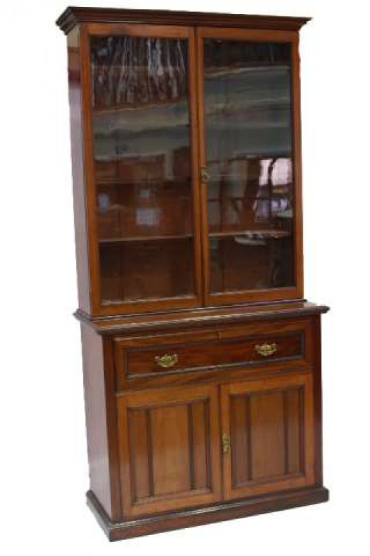 A 19TH CENTURY MAHOGANY SECRETAIRE BOOKCASE, the upper section with a pair of glazed doors below a projecting moulded cornice, the base with a secretaire drawer over a pair of cupboard doors, opening to reveal a bank of eight graduated drawers to one side