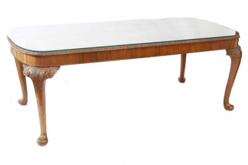 A WALNUT AND BURR WALNUT DINING SUITE, c.1930's, comprising an inverted breakfront sideboard, fitted with a pair of cupboard doors flanking a pair of drawers, raised on leaf-carved cabriole legs terminating in pads, 94.5cm by 166.5cm by 61cm; a dining tab