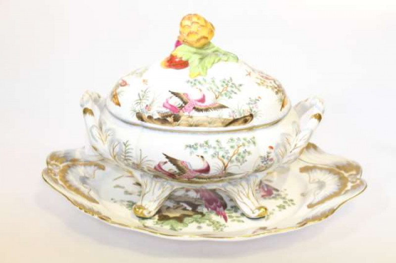 Continental tureen, cover and stand having exotic bird decoration, fruit finial and gilt highlights