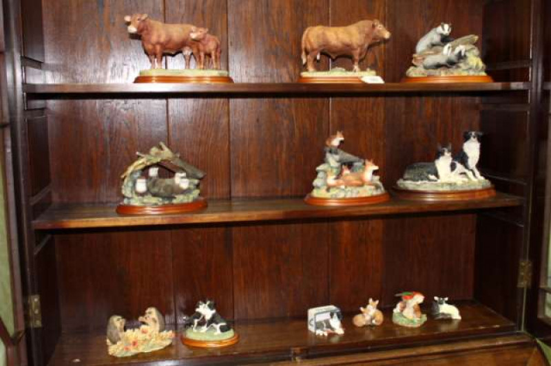 Collection of twelve Border Fine Arts groups, including badger family, Limousin bull, otter family and fruit fun
