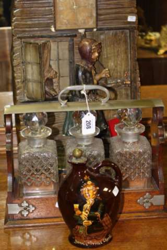 Doulton Kings Ware 'Dewars' decanter, three bottle tantalus and plaster Red Riding Hood clock (3)