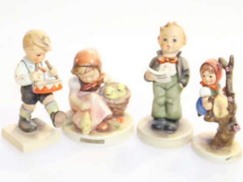 Four Hummel children figures