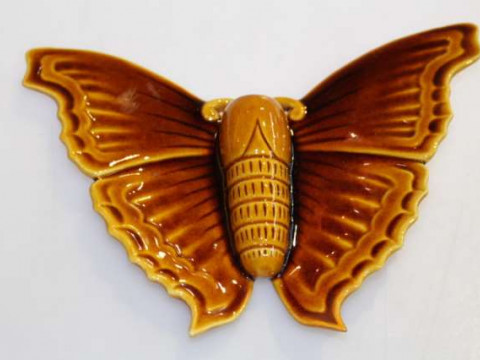 Linthorpe pottery treacle glazed butterfly wall vase, no. 1745