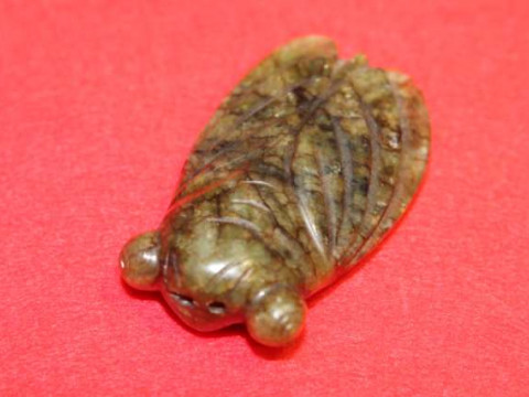 Green stone carving of an insect