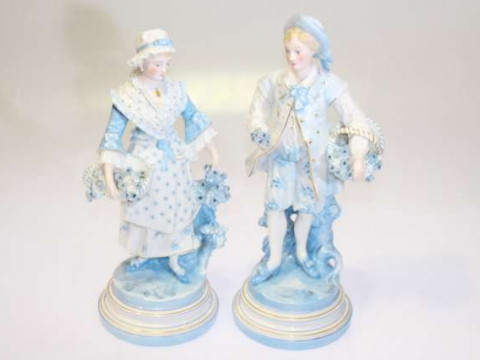 Pair of Continental blue tinted porcelain figures