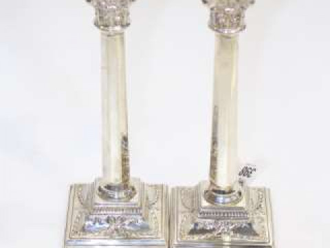 Pair of silver columnar candlesticks, London 1957