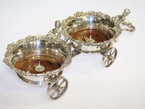 Pair of silver-plated coasters, designed as a trailer