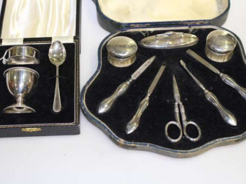 Silver christening set and a silver mounted manicure set