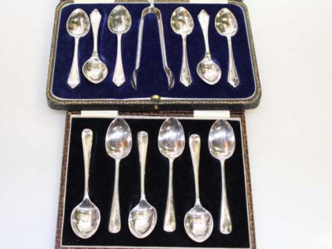 Two cased sets of silver teaspoons