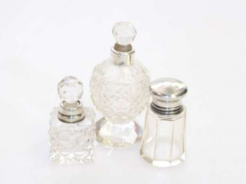 Three silver collared scent bottles