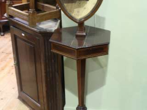 Late 19th Century mahogany and satinwood shaving stand having shield shaped...