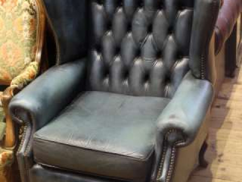Blue deep buttoned leather wing fireside chair on cabriole legs