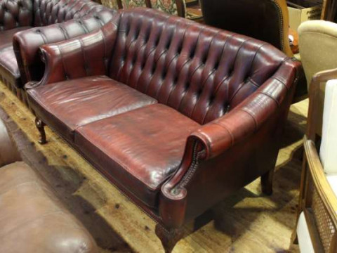 Ox blood deep buttoned leather two seater settee on cabriole legs