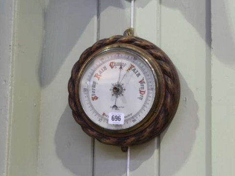 Circular oak aneroid barometer signed B. Cooke & Son, Hull