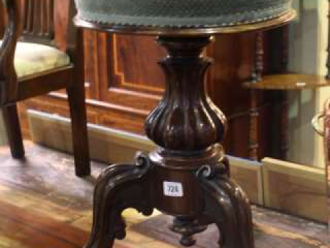 19th Century rosewood revolving piano stool on baluster stem to three...