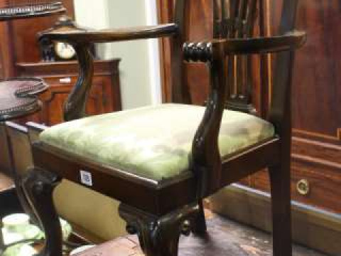 George III style mahogany child's elbow chair on ball and claw legs