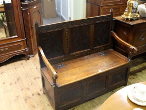 Carved oak triple panel back box settle