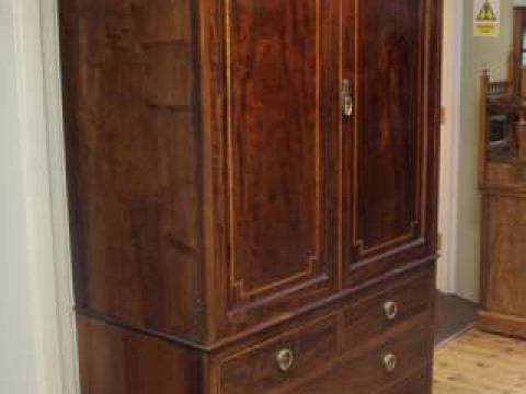 Late 19th Century mahogany and satinwood crossbanded linen press having...