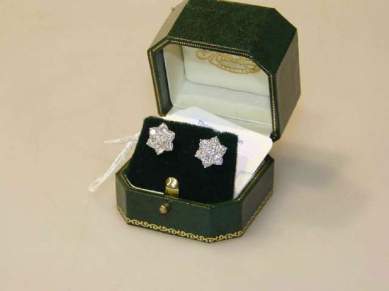 Pair of 18 carat gold and diamond earrings