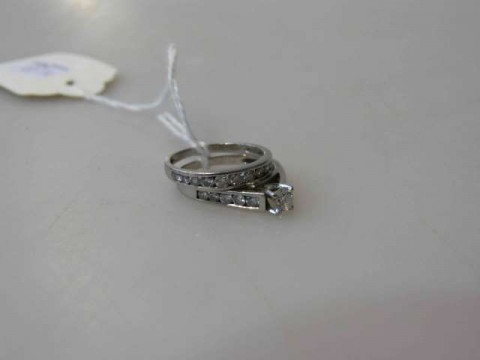Two platinum and diamond rings, size N