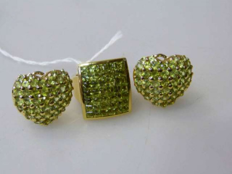 Suite of 18 carat and peridot jewellery comprising ring and a pair of...