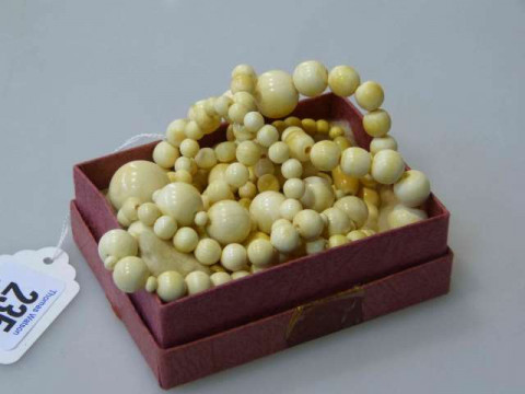 Two antique ivory bead necklaces