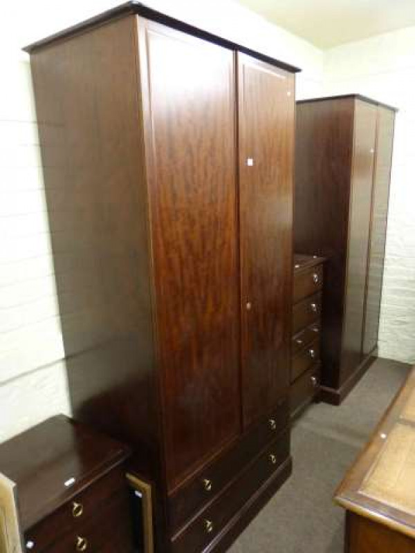 Two tall Stag mahogany wardrobes, two Stag chests and two wall mirrors (6)
