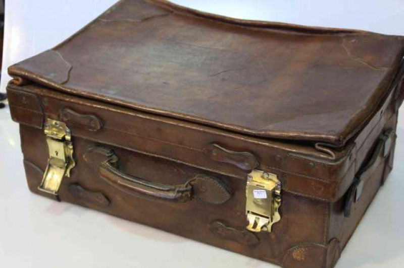 Vintage leather suitcase with brass fittings