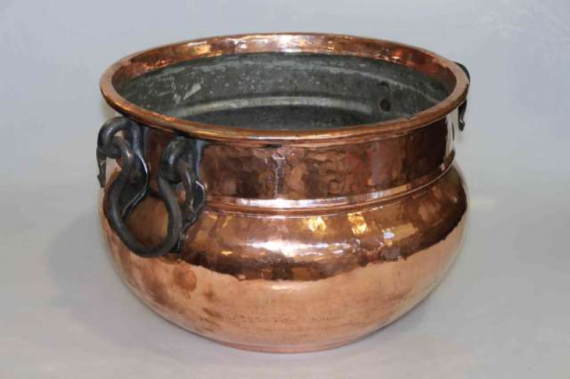 Large beaten copper planter with iron handles