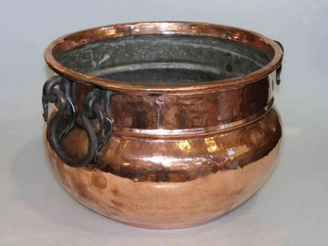 Large beaten copper planter with iron handles