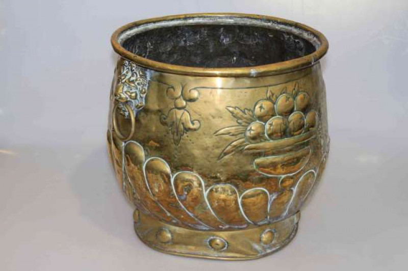 Large antique brass embossed planter with lion mask and ring handles