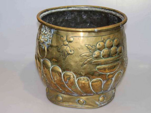 Large antique brass embossed planter with lion mask and ring handles