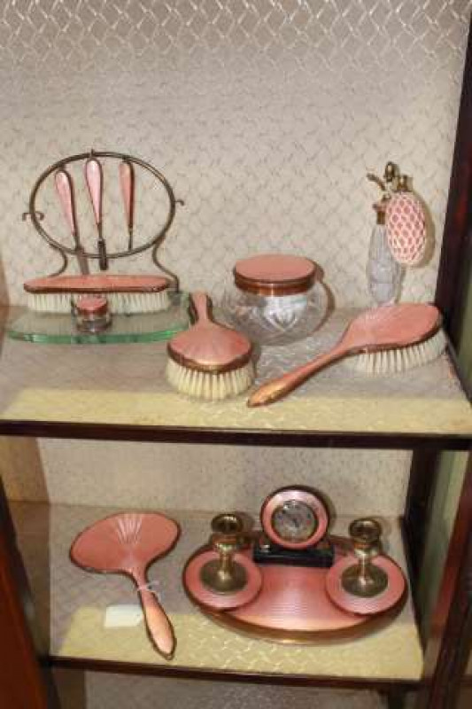 Pink enamel decorated extensive dressing table set including clock and manicure
