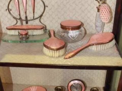 Pink enamel decorated extensive dressing table set including clock and...