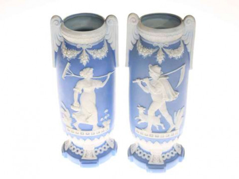 Pair Continental blue bisque vases with white relief pastoral figures