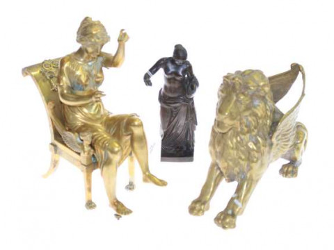 Three brass and bronze figure mounts including Egyptian style seated lady
