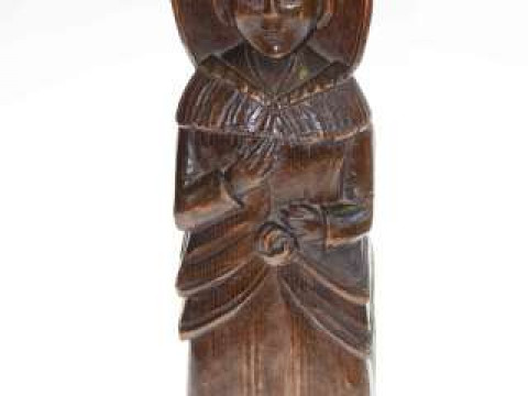 Carved wood figure artifact