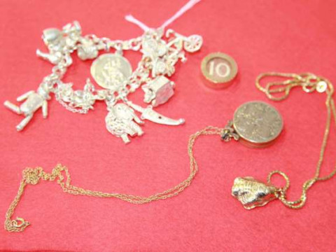 Silver charm bracelet, 9 carat gold locket, 9 carat gold shell-form pendant...