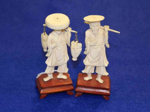 Pair 19th Century ivory figures on wood plinths