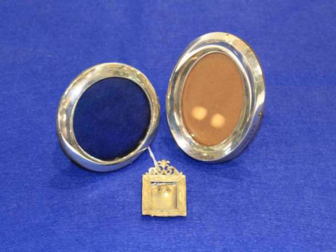 Three silver photograph frames